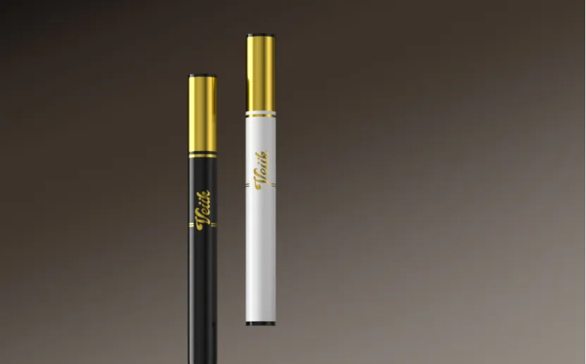 Two slim Veiik vape pens in black and white