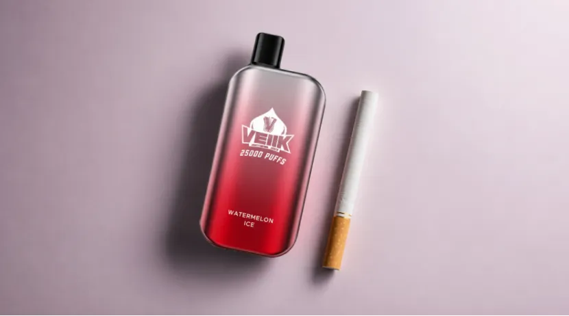 VEIIK disposable vape next to a traditional cigarette